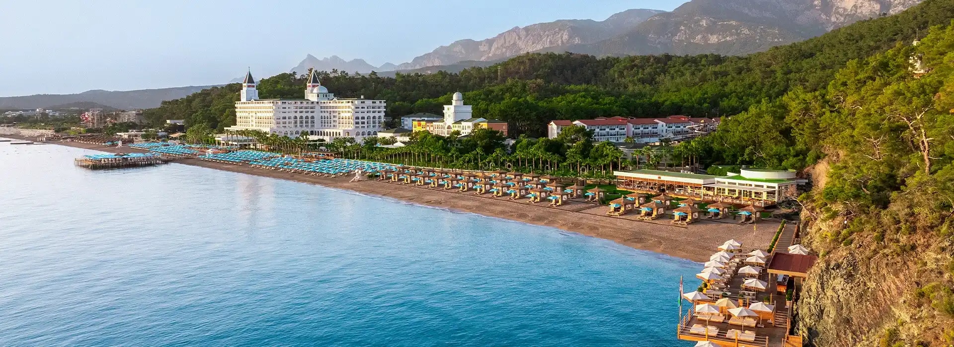 <div style="padding-left: 70px;"><img style="width: 100px; height: auto; margin: 25px 0;" src="https://b2ccdn.coraltravel.lt/content/Main Page Hotels Banners Destinations_Turkyie LT.svg" loading="lazy"></div>
<div style="padding-left: 70px; margin-bottom: 20px;"><img style="width: 200px; height: auto;" src="https://b2ccdn.coraltravel.lt/content/logos/hotel-logos/nirvana-logo-200.webp" loading="lazy"></div>
<div style="font-size: 28px; font-weight: 600; padding-left: 70px;">Nirvana Hotels</div>