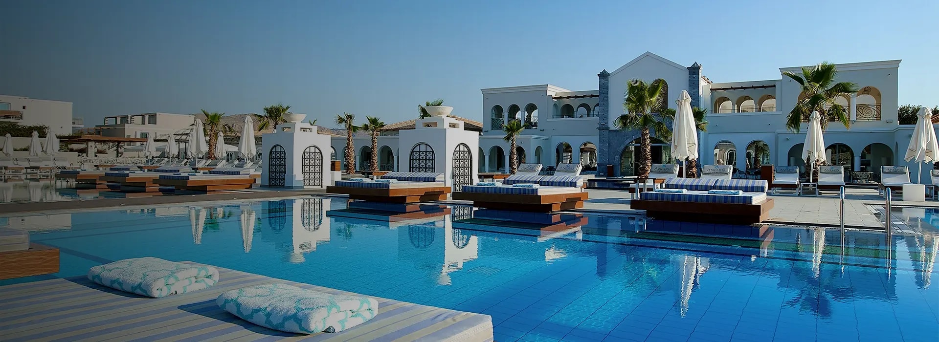 <div style="padding-left: 70px;"><img style="width: 100px; height: auto; margin: 25px 0;" src="https://b2ccdn.coraltravel.lt/content/Main Page Hotels Banners Destinations_Greece LT.svg" loading="lazy"></div>
<div style="padding-left: 70px; margin-bottom: 20px;"><img style="width: 200px; height: auto;" src="https://b2ccdn.coraltravel.lt/content/logos/hotel-logos/anemos-w200px copy.webp" loading="lazy"></div>
<div style="font-size: 28px; font-weight: 600; padding-left: 70px;">ANEMOS LUXURY GRAND RESORT</div>